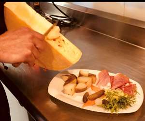 Raclette, an alpine dish with melted cheese