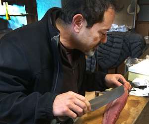Chef Jeff carving sashimi in Japan